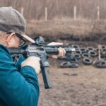 Man shooting PCC rifle