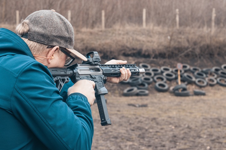 Man shooting PCC rifle
